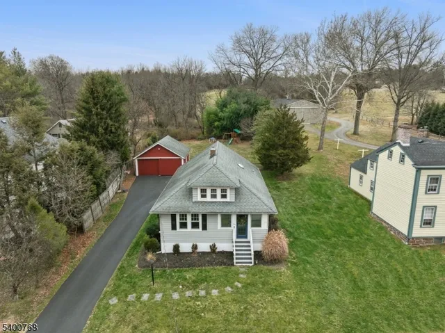 a view of a house with a yard from a balcony