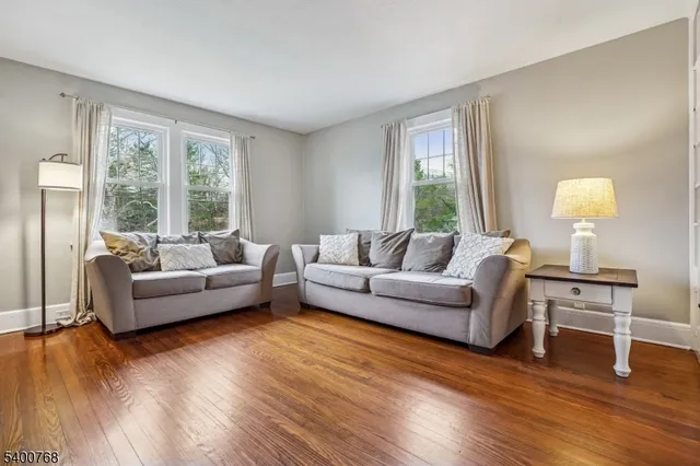 a kitchen with stainless steel appliances granite countertop a refrigerator a stove a sink and a microwave