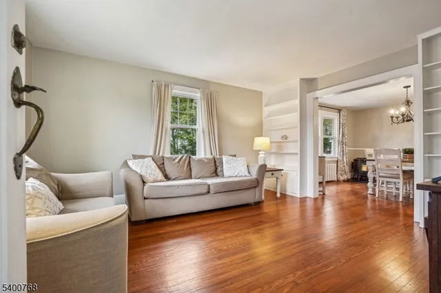 a view of a dining room with furniture wooden floor and chandelier