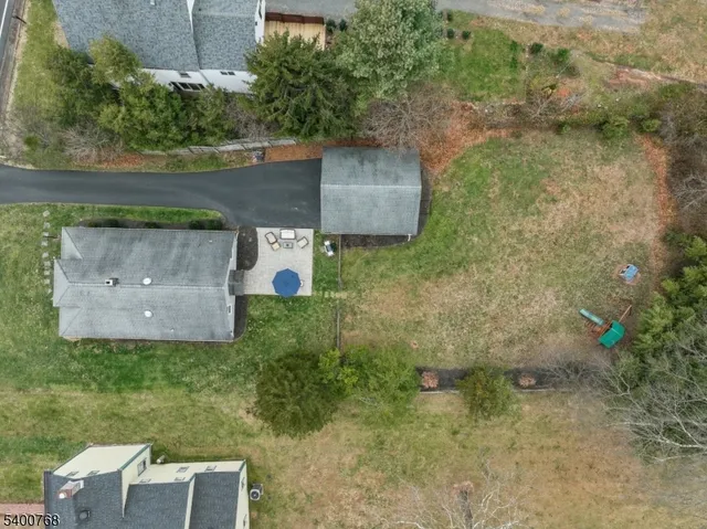 a view of a field of grass and trees