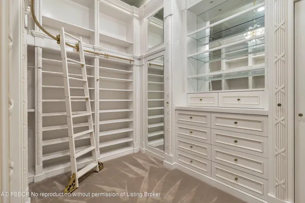 a bathroom with a sink vanity and a mirror
