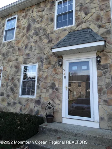 a view of a brick house with a door