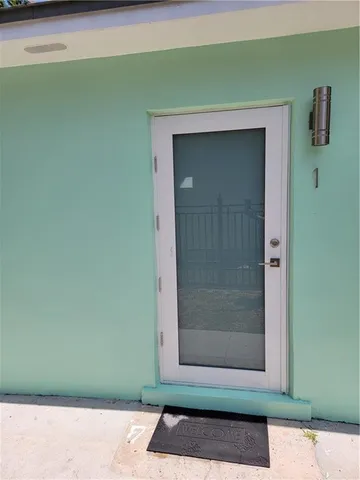 a view of door with a bench