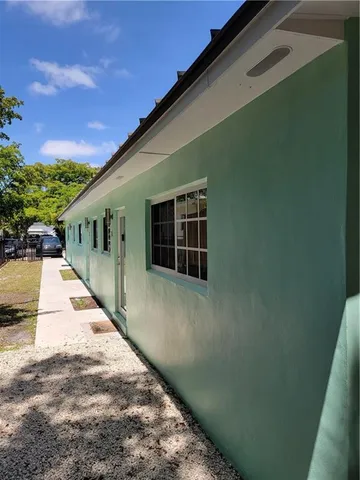 a view of backyard with green space