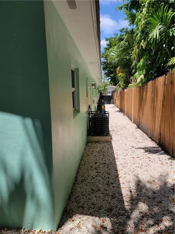 a view of a backyard of the house