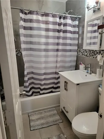 a bathroom with a sink and toilet