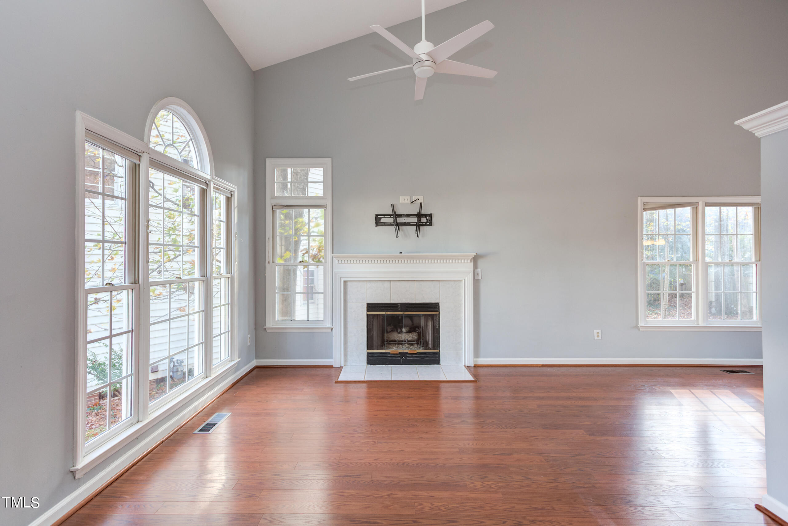 2800 Polesdon Court Raleigh, NC 27615 - Photo 4 of 21 Soaring ceilings and a cozy fireplace create a welcoming place to gather.