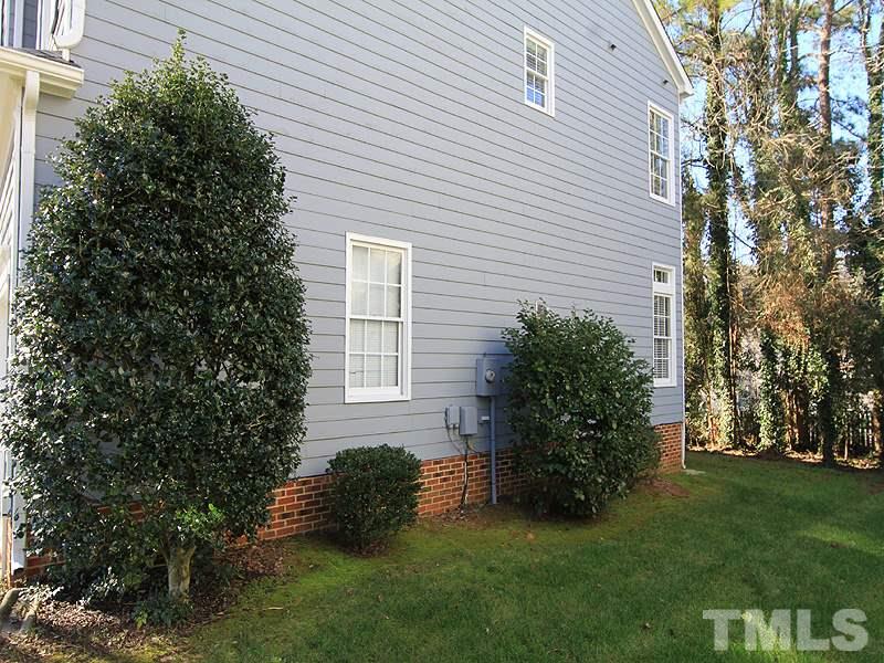 9021 Breeland Way Raleigh, NC 27613 - Photo 17 of 20 a view of house with a yard