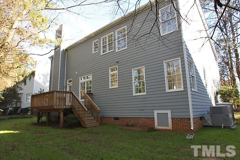 9021 Breeland Way Raleigh, NC 27613 - Photo 19 of 20 a front view of a house with a garden