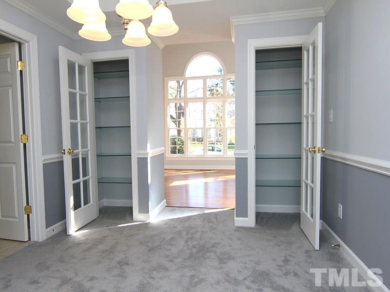 9021 Breeland Way Raleigh, NC 27613 - Photo 6 of 20 a view of an empty room with a window