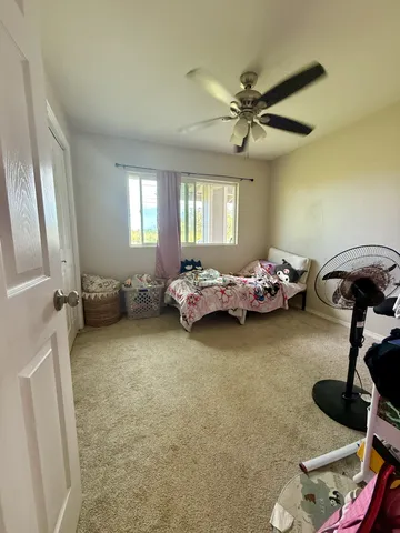 a bedroom with furniture and a window