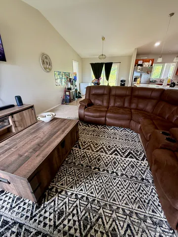a living room with a couch and a table in it