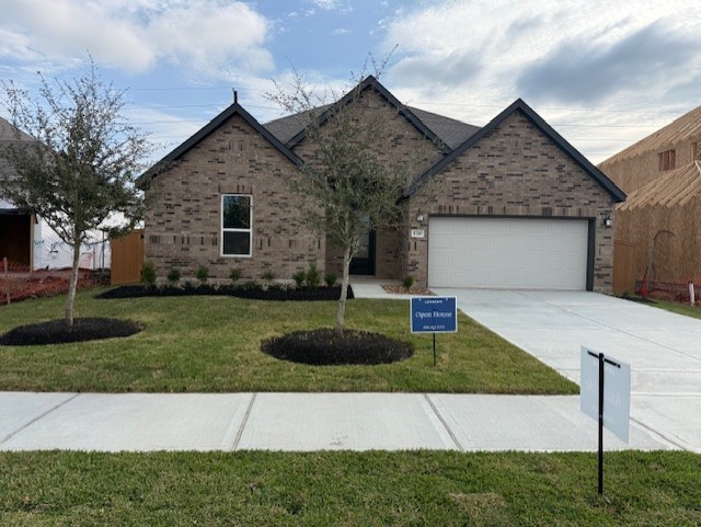 8223 Holly Blue Drive Rosharon, TX 77583 - Photo 1 of 48 a front view of a house with a yard