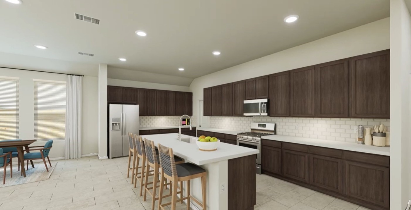 8223 Holly Blue Drive Rosharon, TX 77583 - Photo 24 of 48 a kitchen with a sink a refrigerator and wooden cabinets