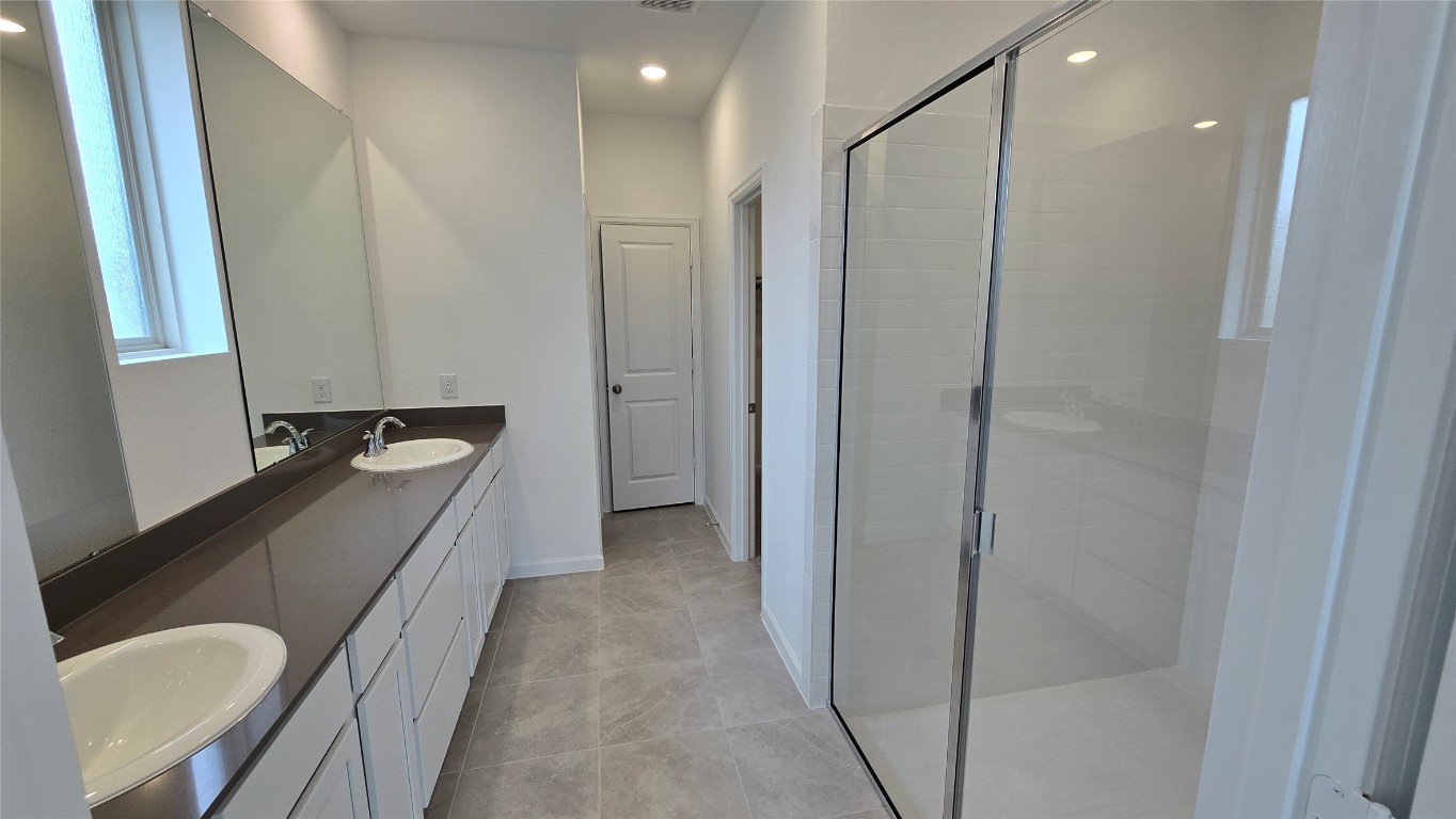 8223 Holly Blue Drive Rosharon, TX 77583 - Photo 43 of 48 a bathroom with a sink and a mirror