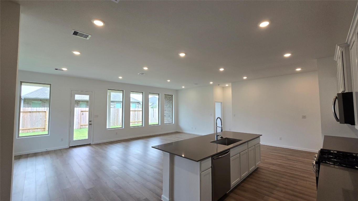 8223 Holly Blue Drive Rosharon, TX 77583 - Photo 20 of 48 a kitchen with a sink and a stove top oven