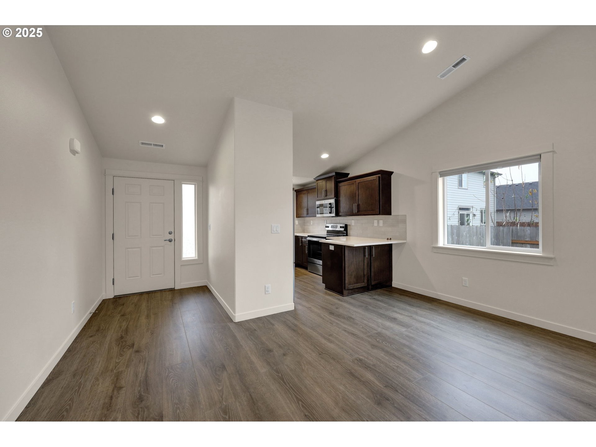 1632 Dotie Drive Springfield, OR 97477 - Photo 5 of 29 a view of kitchen with a sink wooden floor and windows
