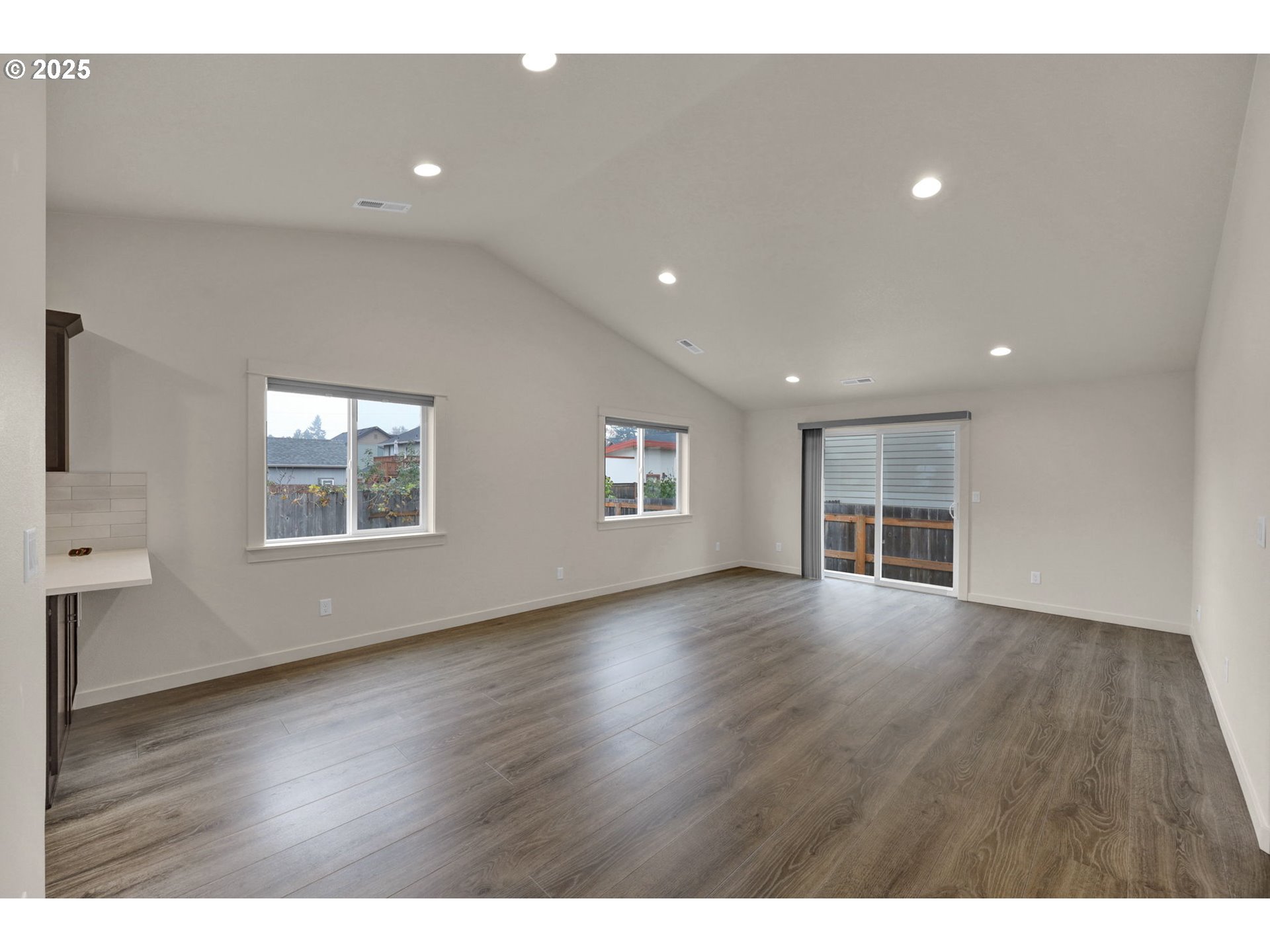 1632 Dotie Drive Springfield, OR 97477 - Photo 6 of 29 a view of an empty room with wooden floor and a window