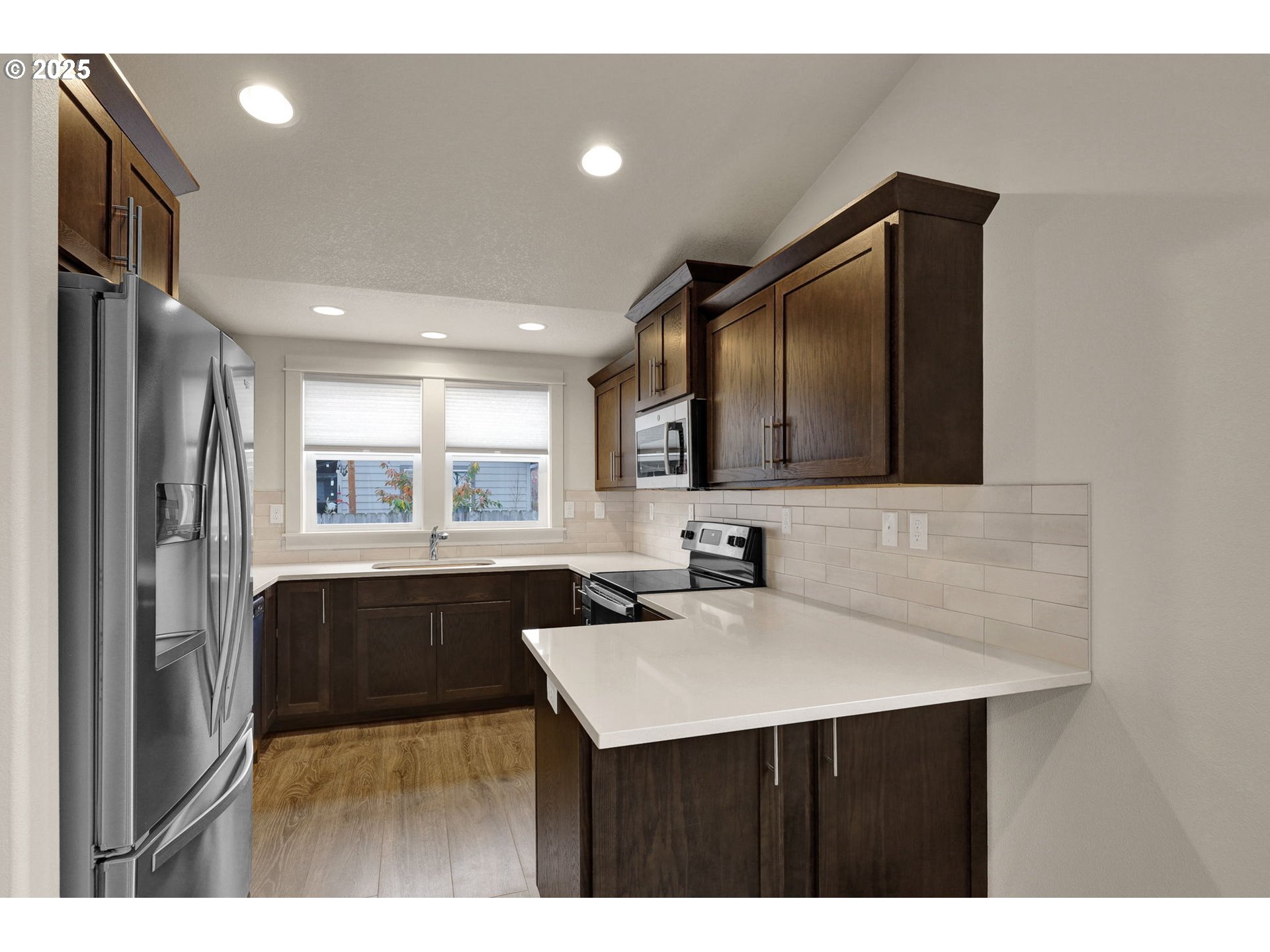1632 Dotie Drive Springfield, OR 97477 - Photo 9 of 29 a kitchen with a sink and a refrigerator