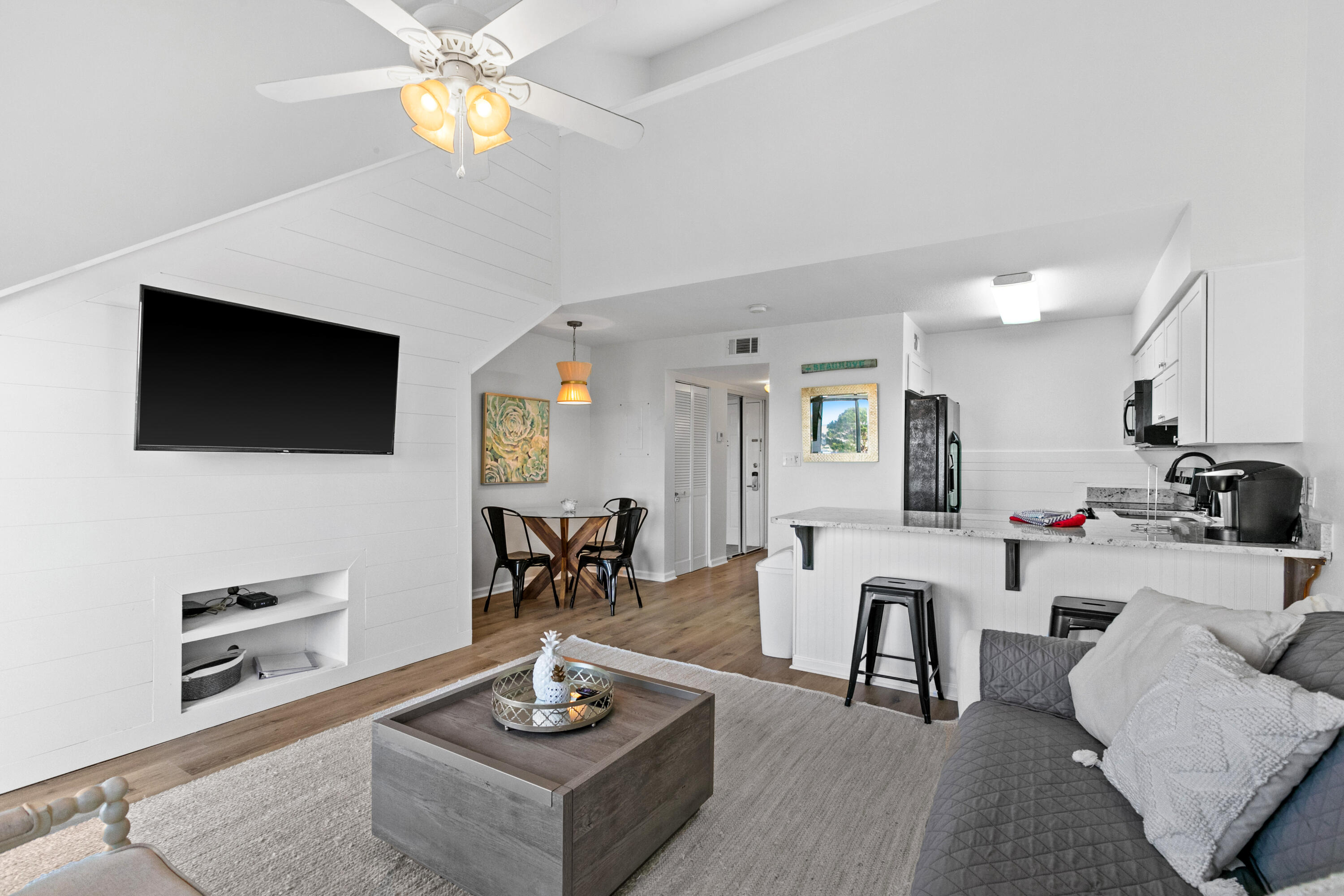145 Beachfront Trail, Unit 302A Santa Rosa Beach, FL 32459 - Photo 11 of 21 a living room with furniture a flat screen tv and kitchen view