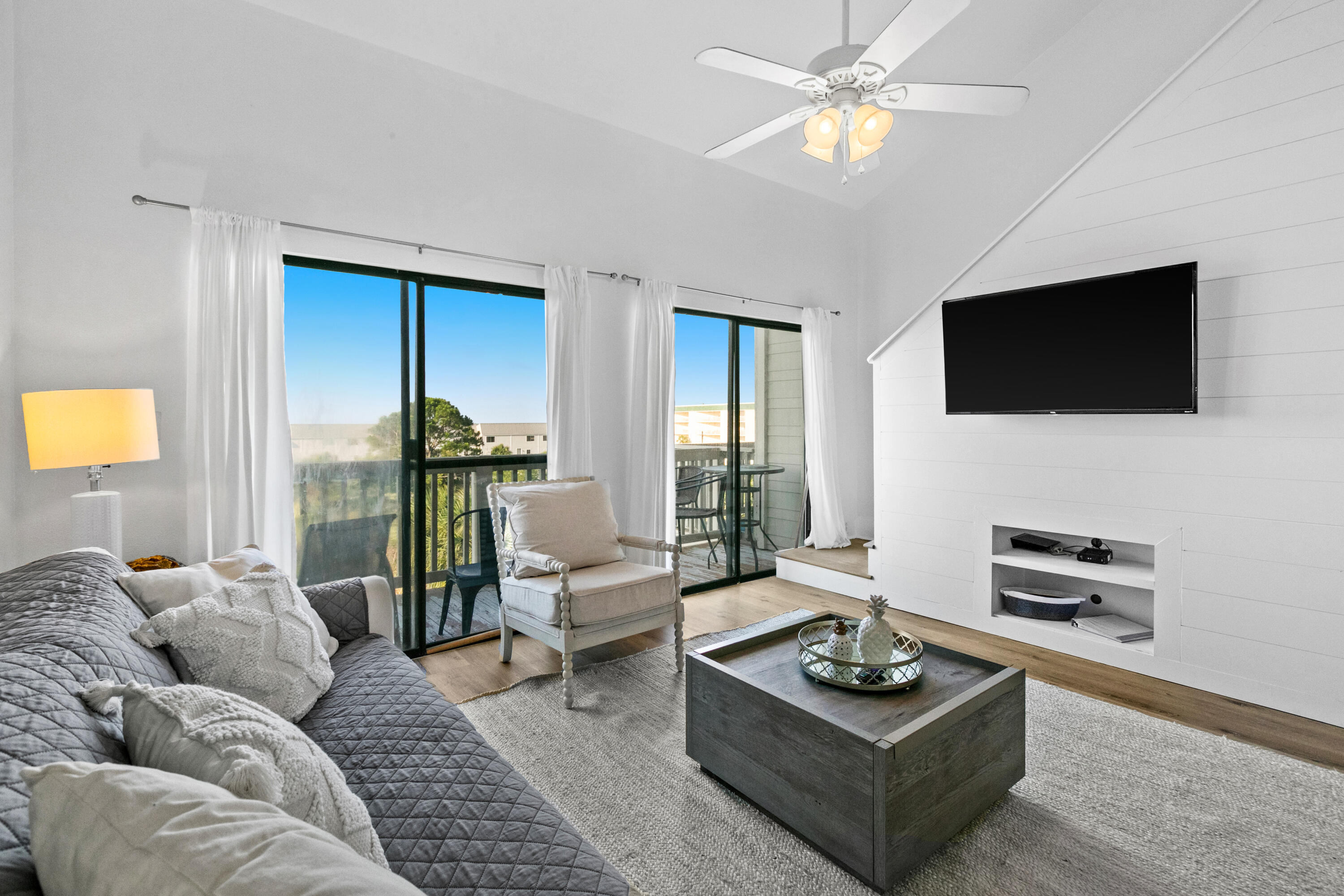 145 Beachfront Trail, Unit 302A Santa Rosa Beach, FL 32459 - Photo 12 of 21 a living room with furniture a flat screen tv and a large window