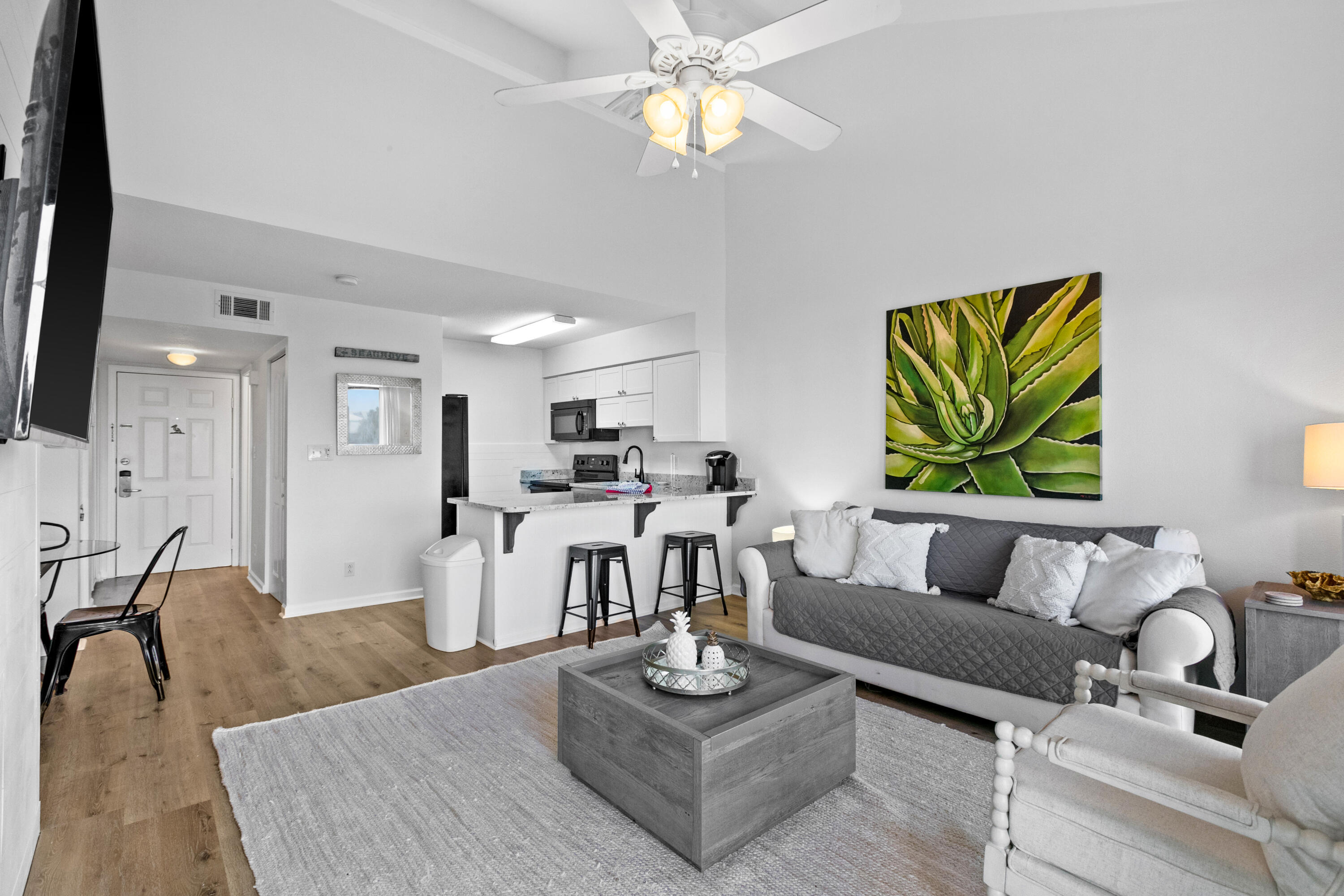 145 Beachfront Trail, Unit 302A Santa Rosa Beach, FL 32459 - Photo 13 of 21 a living room with furniture kitchen view and a chandelier