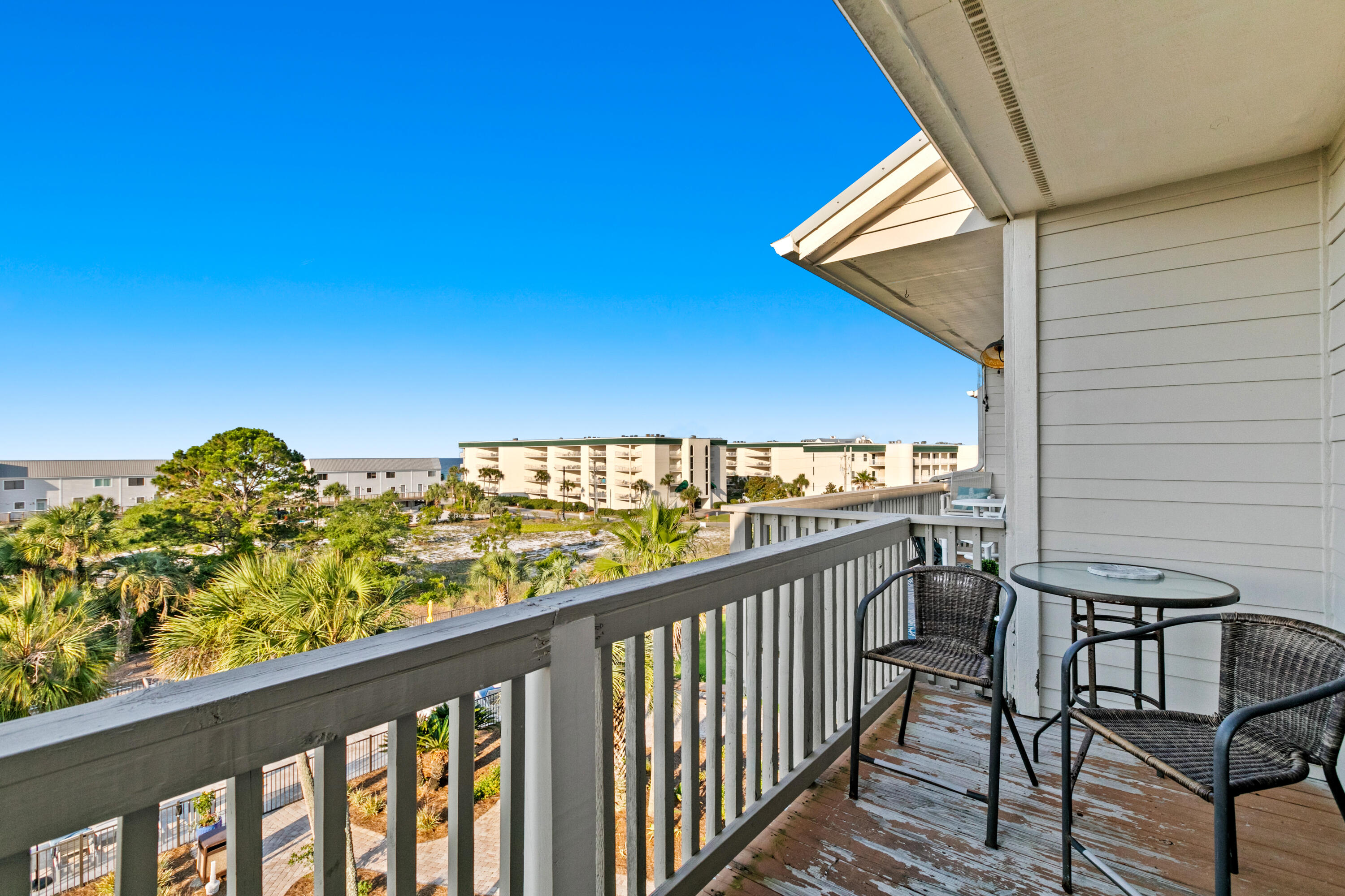 145 Beachfront Trail, Unit 302A Santa Rosa Beach, FL 32459 - Photo 18 of 21 a view of a balcony next to a yard