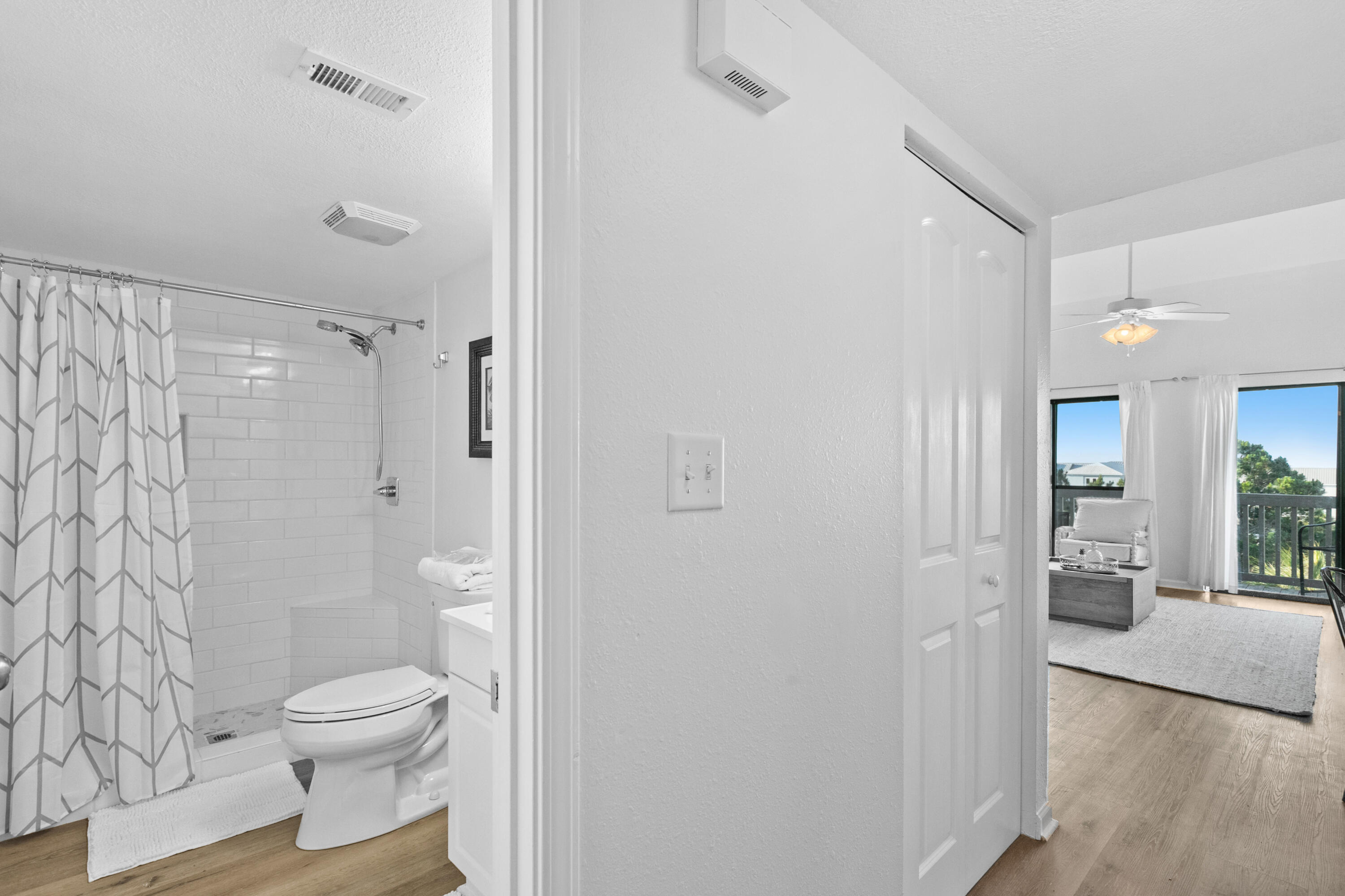 145 Beachfront Trail, Unit 302A Santa Rosa Beach, FL 32459 - Photo 8 of 21 a bathroom with a granite countertop toilet a sink and a mirror