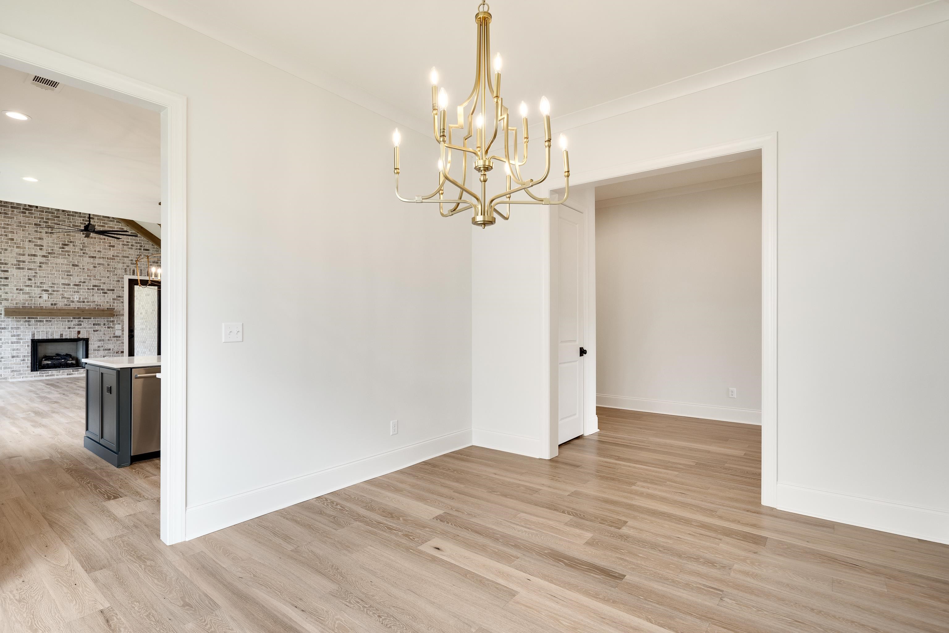 65 Magnolia Rdg Drive Rossville, TN 38066 - Photo 12 of 40 a view of a kitchen with wooden floor and stainless steel appliances
