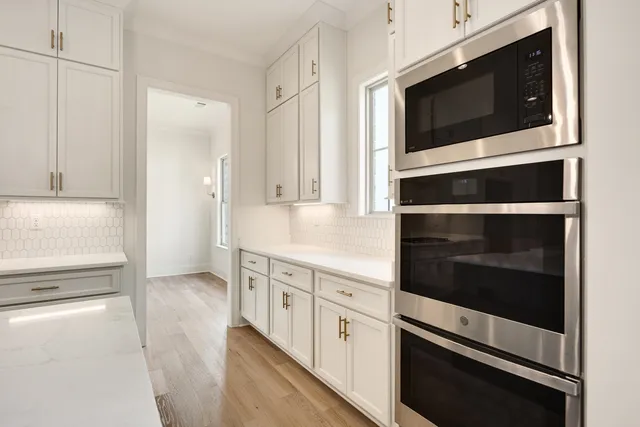 a view of hallway with wooden floor
