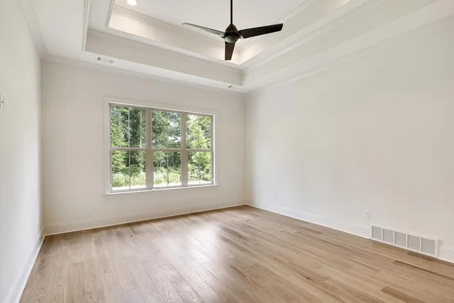 a spacious bathroom with a large tub shower and sink