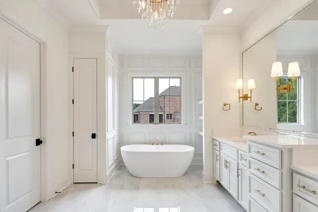 a bathroom with a sink toilet tub and shower
