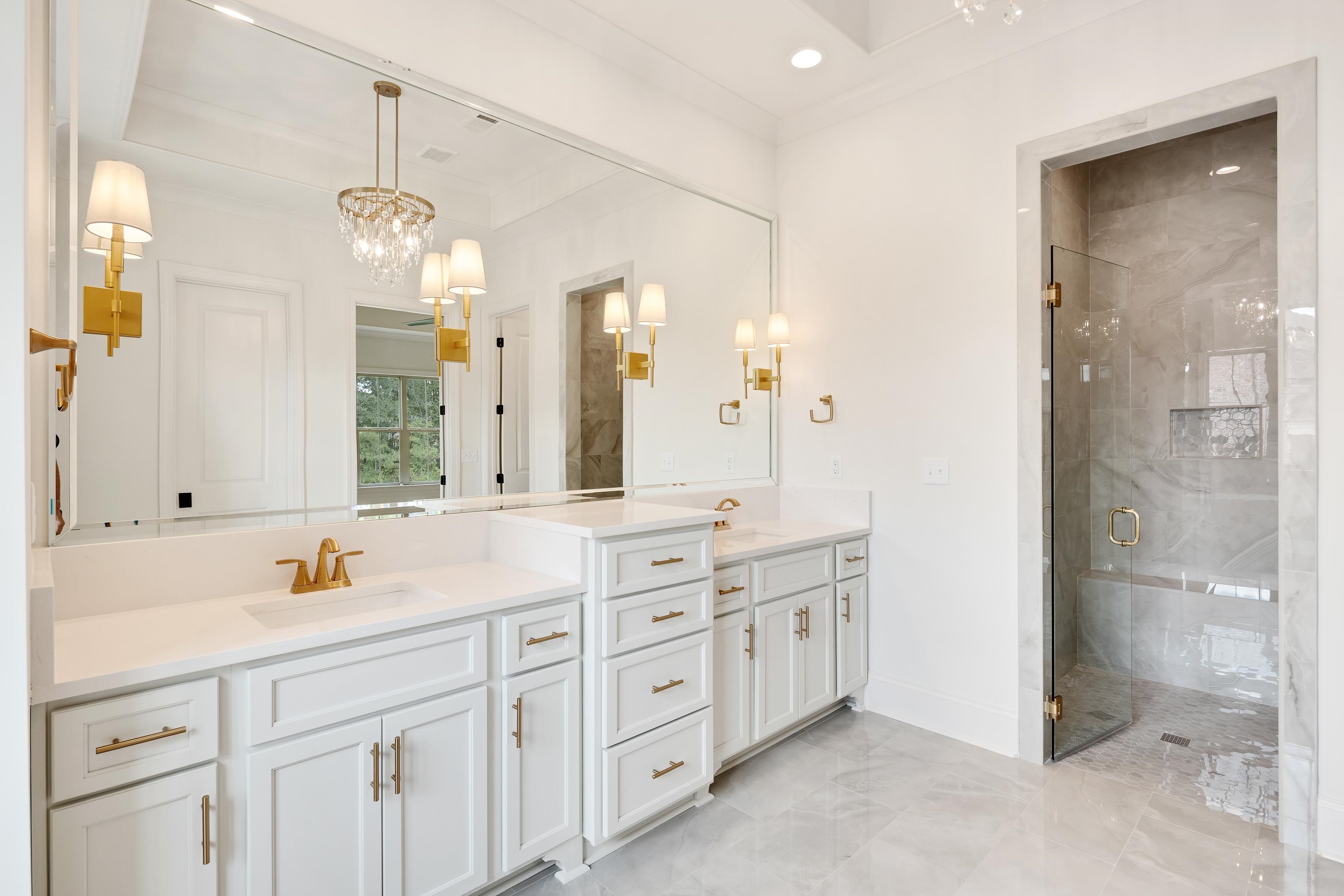65 Magnolia Rdg Drive Rossville, TN 38066 - Photo 23 of 40 a spacious bathroom with a granite countertop sink a mirror a shower and a bathtub