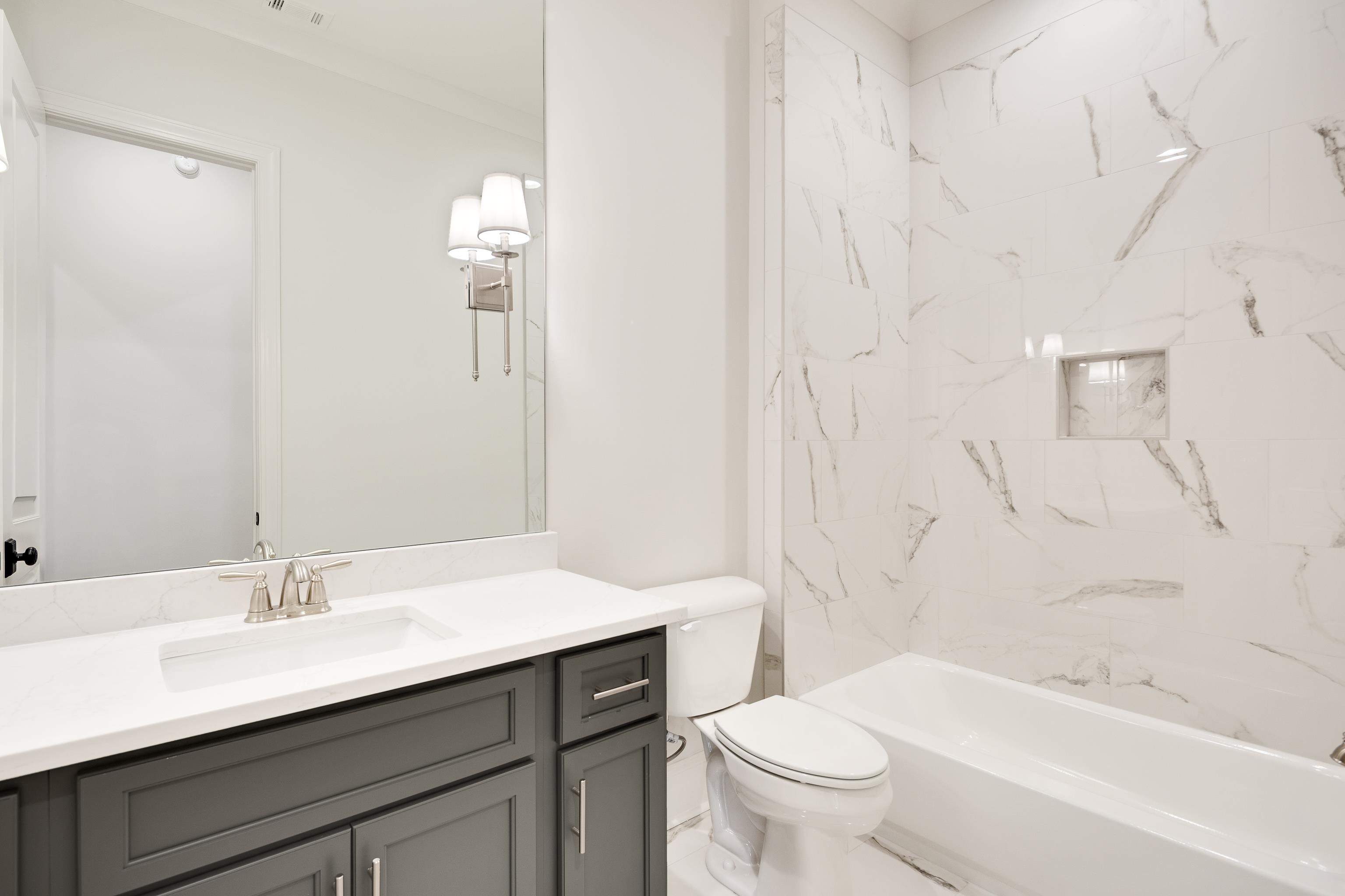 65 Magnolia Rdg Drive Rossville, TN 38066 - Photo 25 of 40 a bathroom with a sink toilet tub and shower