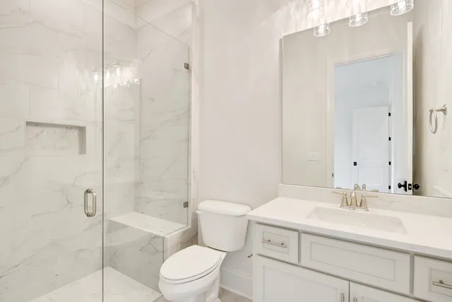 an empty room with a ceiling fan and entryway