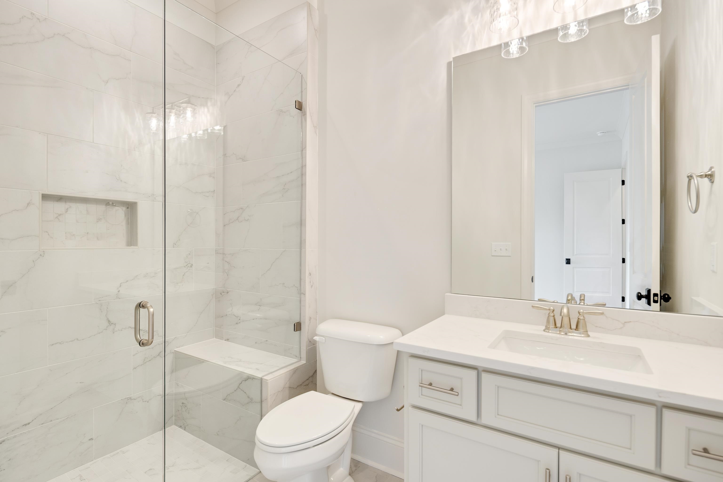 65 Magnolia Rdg Drive Rossville, TN 38066 - Photo 27 of 40 a bathroom with a sink a toilet and shower