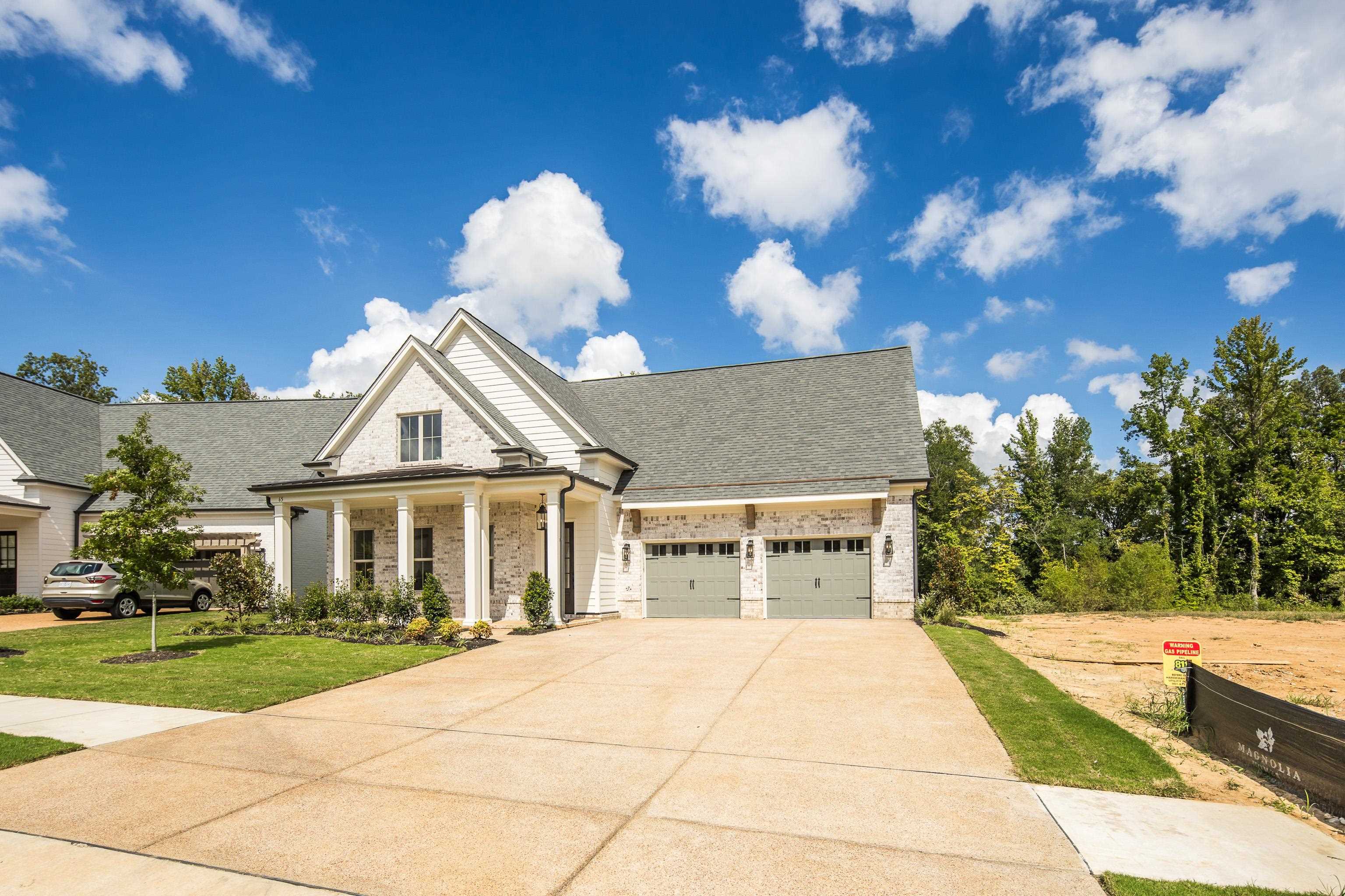65 Magnolia Rdg Drive Rossville, TN 38066 - Photo 3 of 40 a front view of a house with a yard