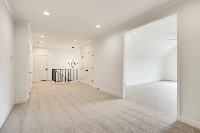 a view of an empty room with a fireplace and a window