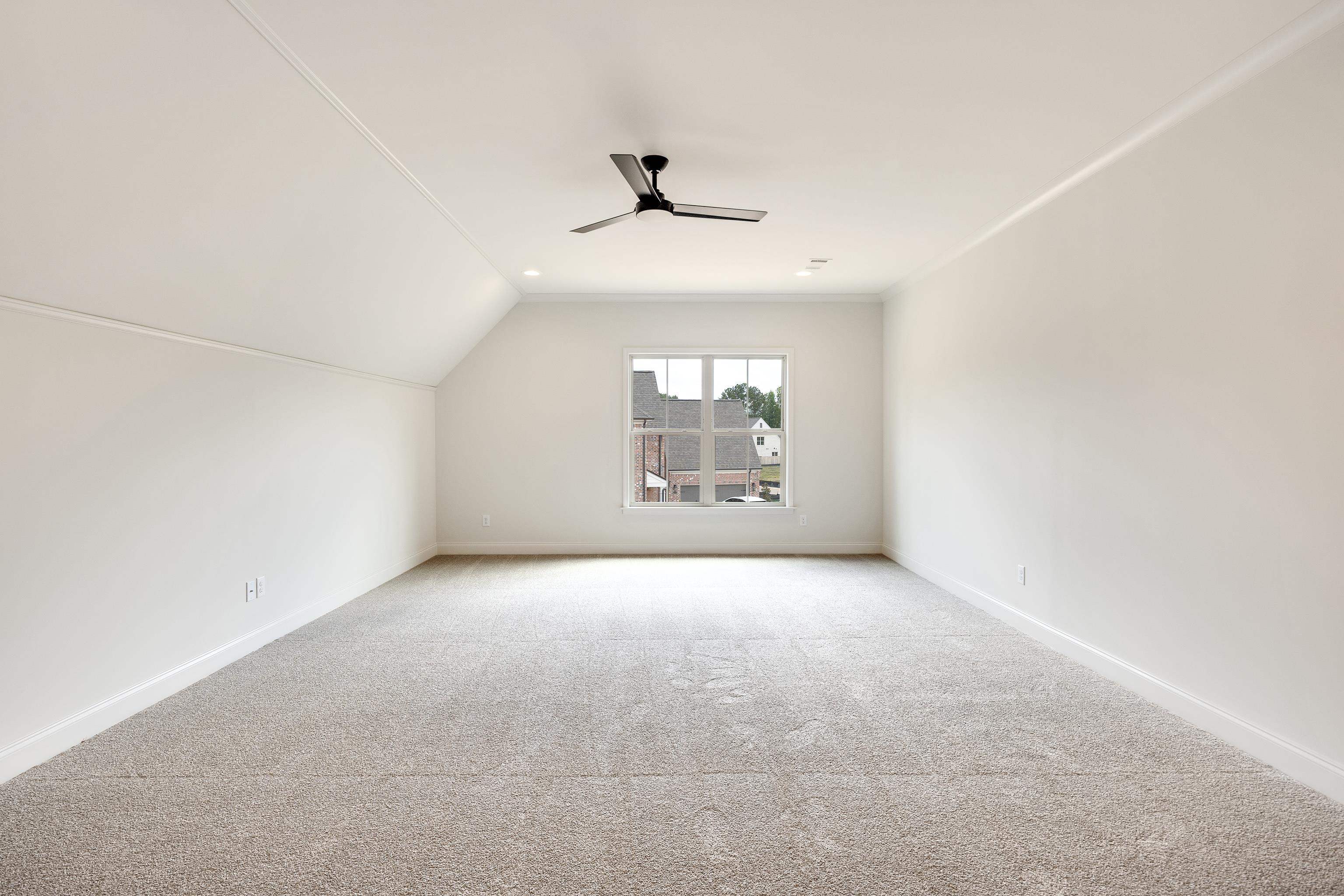 65 Magnolia Rdg Drive Rossville, TN 38066 - Photo 32 of 40 an empty room with a windows and ceiling fan