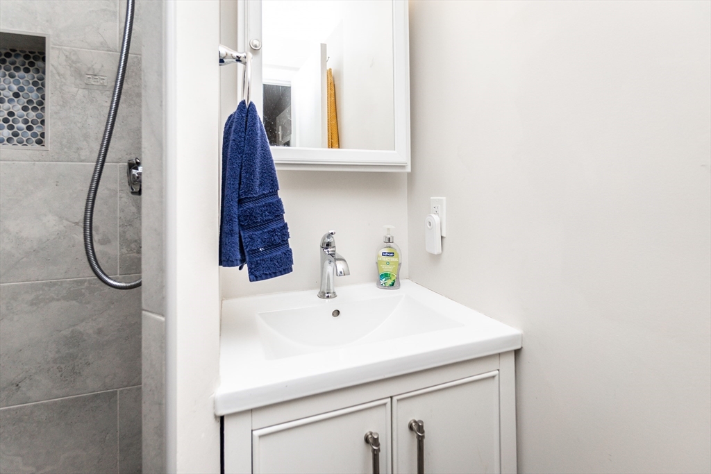 8 Sawyer Avenue Canton, MA 02021 - Photo 10 of 13 a bathroom with a sink and a window