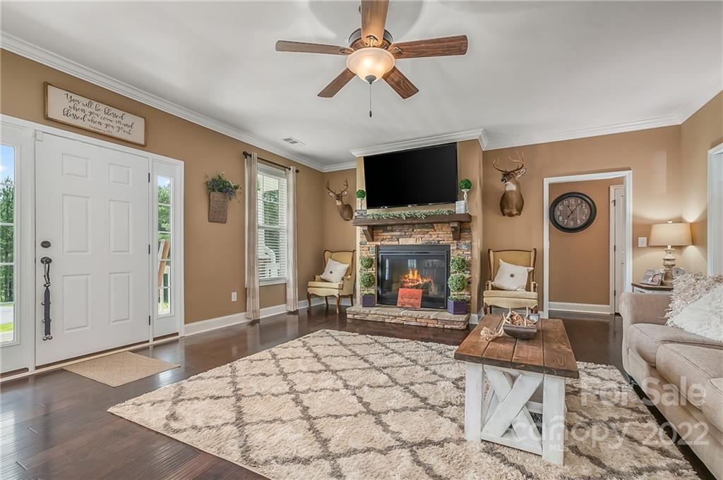 624 Spur Alley, Unit 19 Rutherfordton, NC 28139 - Photo 14 of 41 a living room with furniture a flat screen tv and a fireplace