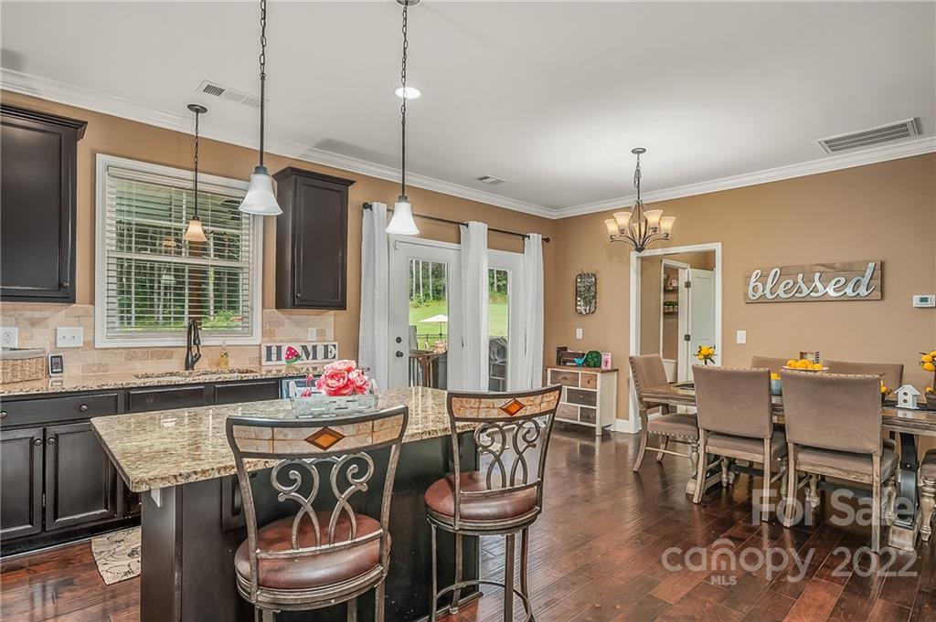 624 Spur Alley, Unit 19 Rutherfordton, NC 28139 - Photo 19 of 41 a dining table with chairs and window