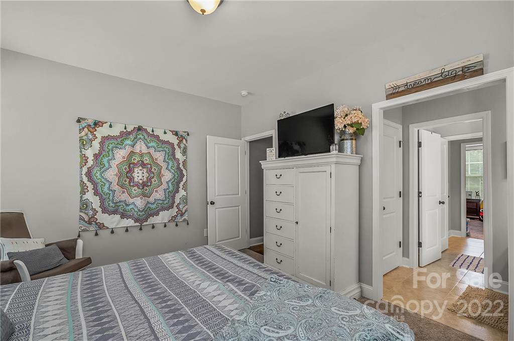 624 Spur Alley, Unit 19 Rutherfordton, NC 28139 - Photo 22 of 41 a bedroom with a bed and a television