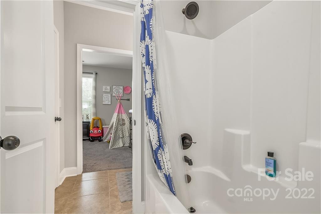 624 Spur Alley, Unit 19 Rutherfordton, NC 28139 - Photo 23 of 41 a bathroom with a tub and shower