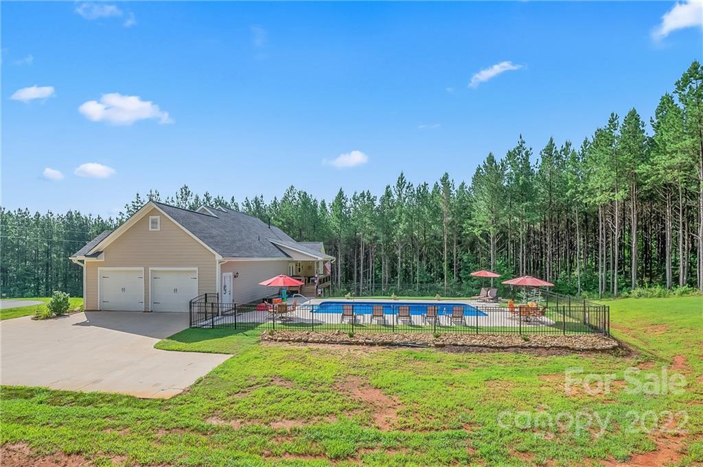 624 Spur Alley, Unit 19 Rutherfordton, NC 28139 - Photo 3 of 41 a house view with a sitting space and garden view
