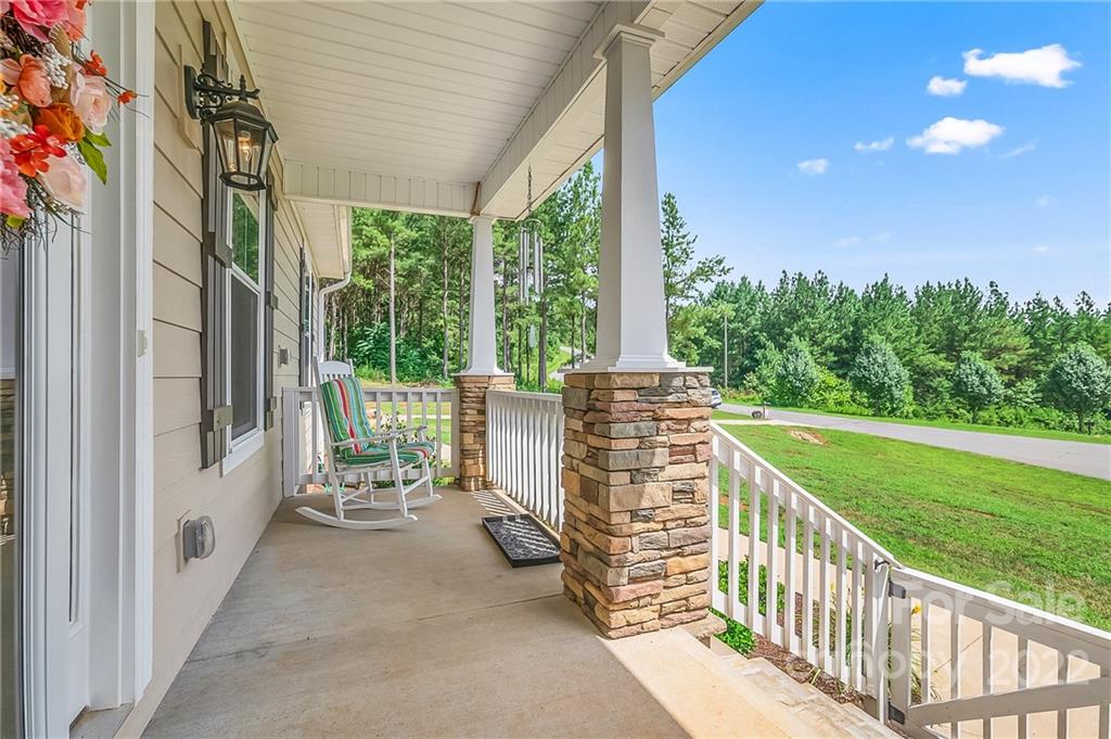 624 Spur Alley, Unit 19 Rutherfordton, NC 28139 - Photo 34 of 41 a view of a porch with chairs and backyard