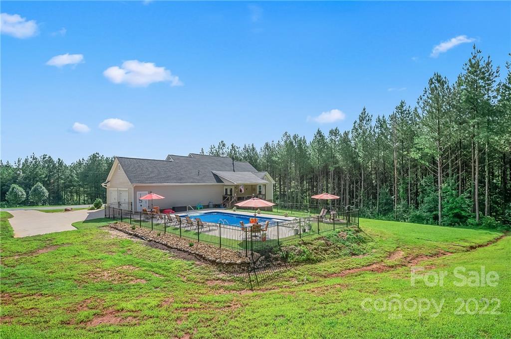 624 Spur Alley, Unit 19 Rutherfordton, NC 28139 - Photo 36 of 41 a swimming pool with outdoor seating and yard