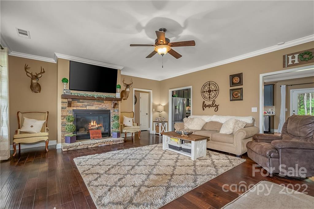 624 Spur Alley, Unit 19 Rutherfordton, NC 28139 - Photo 5 of 41 a living room with furniture fireplace and flat screen tv