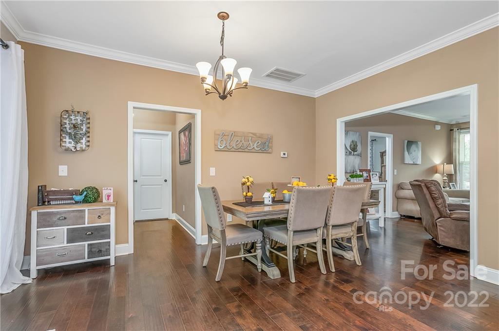 624 Spur Alley, Unit 19 Rutherfordton, NC 28139 - Photo 7 of 41 a view of a dining room with furniture and wooden floor