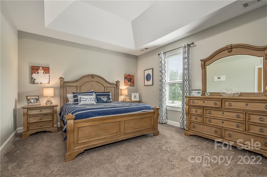 624 Spur Alley, Unit 19 Rutherfordton, NC 28139 - Photo 8 of 41 a bedroom with a bed and a dresser
